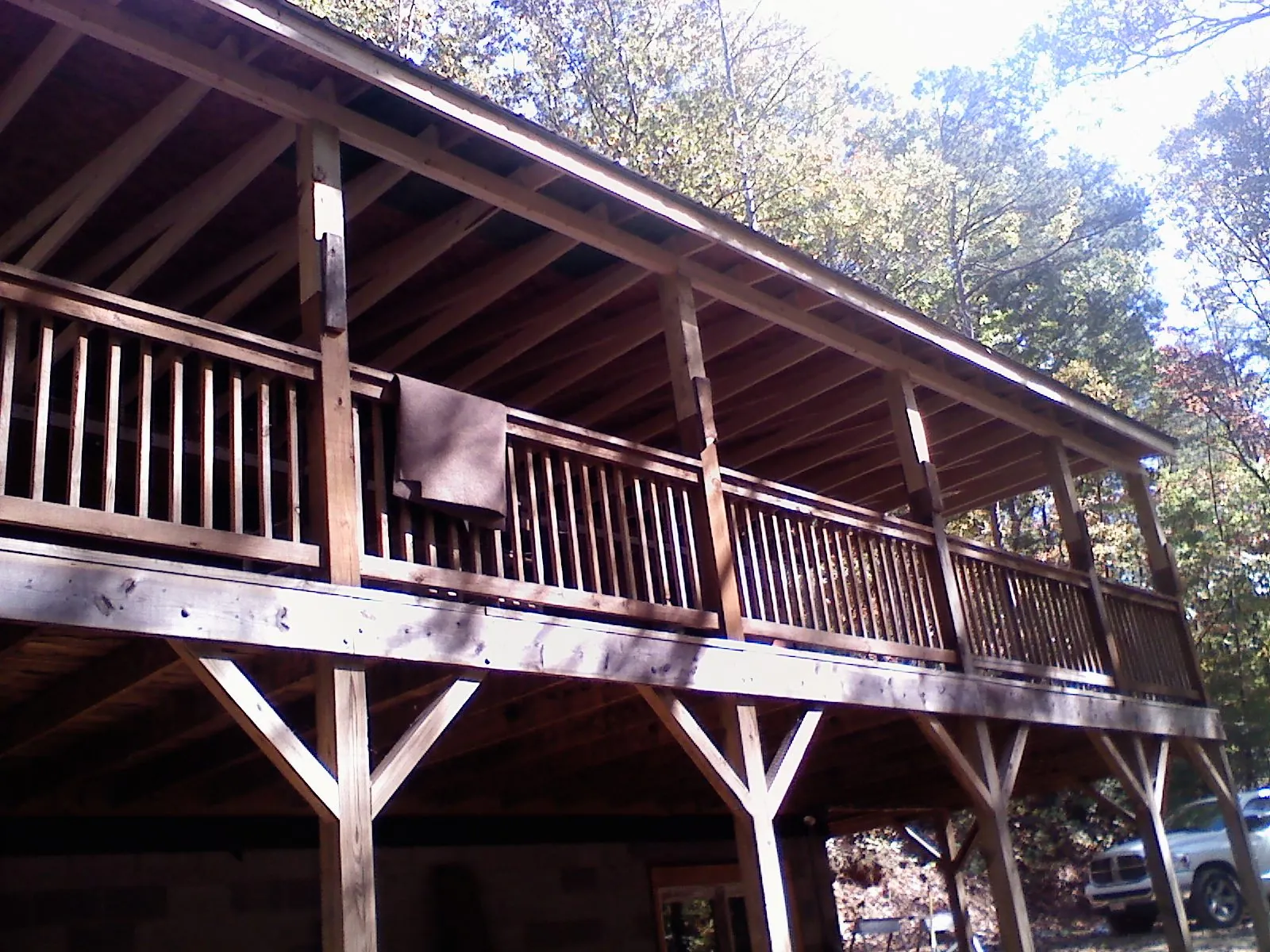 Timber framing under a new elevated porch and deck — Roof Leak Repair in Lacota by Roofing Brothers